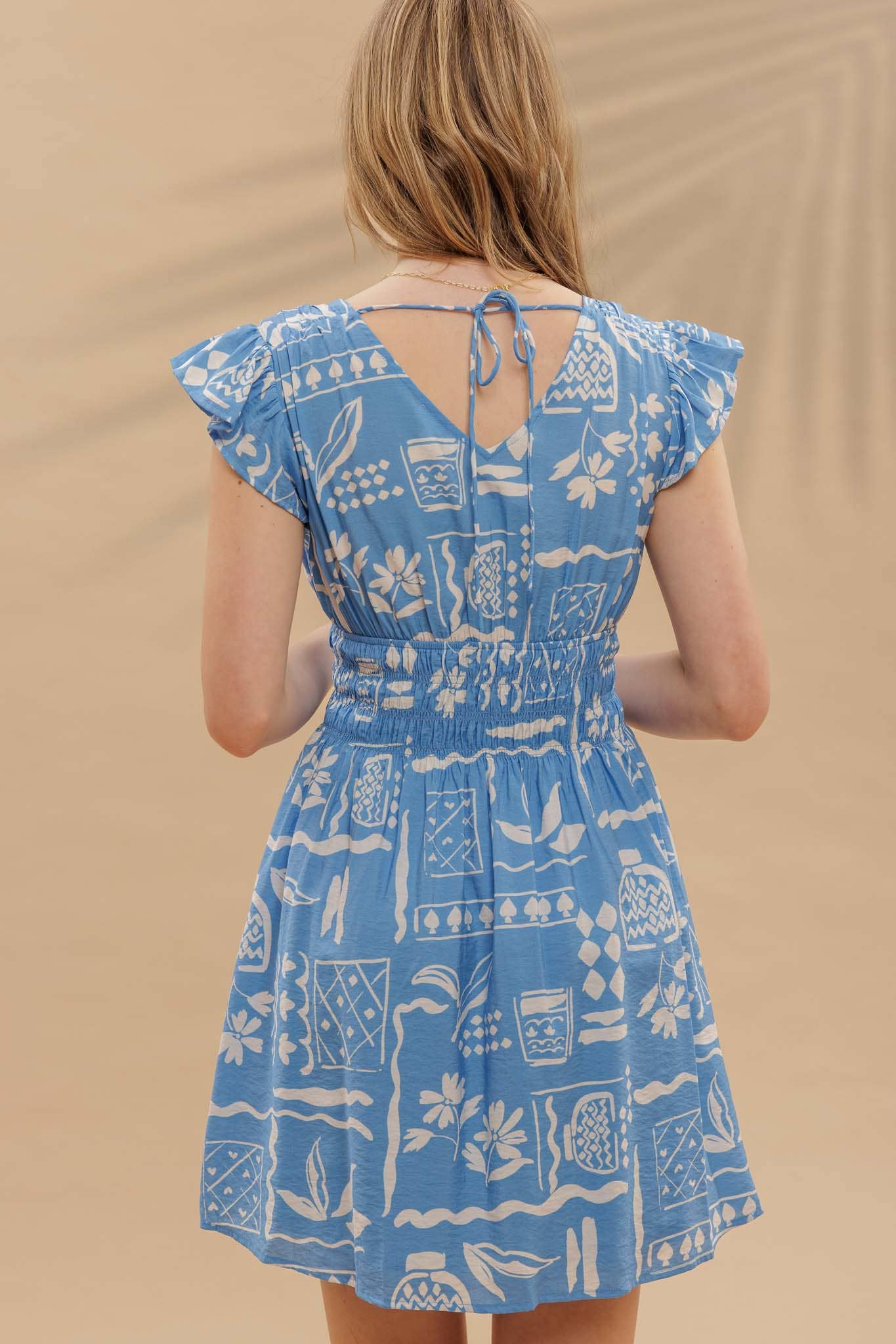 Blu Pepper Print V Neck Ruffle Mini Dress